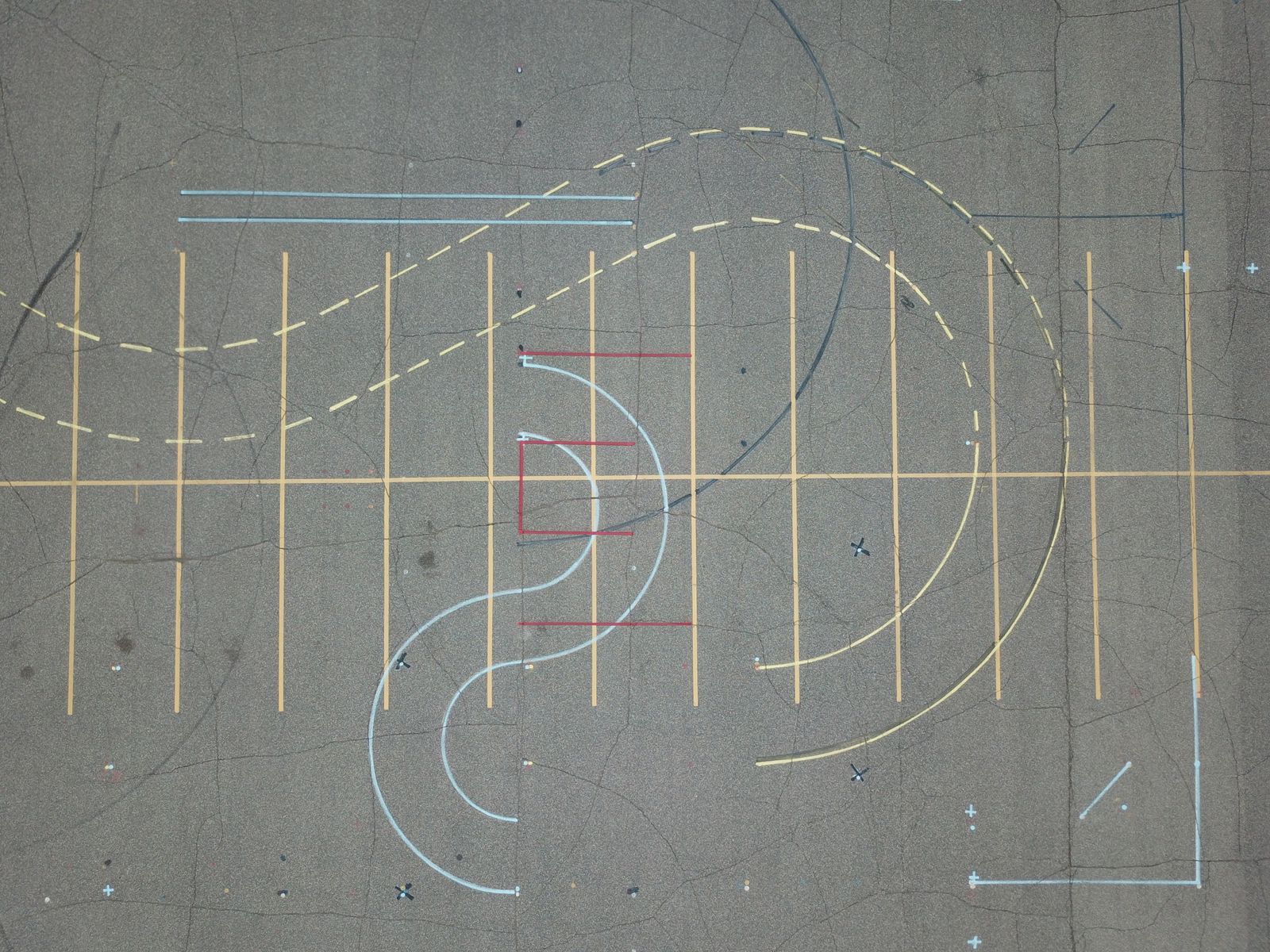 Locate markings applied to a paved surface